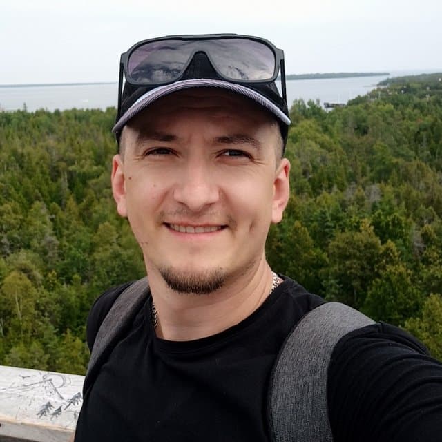 Viktor Bezai, founder of EnvolPrep, on a lookout over an Ontario forest